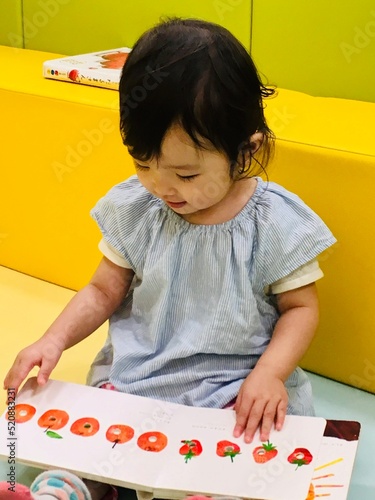 little child playing with toys