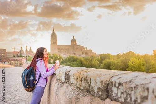 Salamanca spain, castile and leon. unesco tourism cathedral sunset with female young latin tourist
