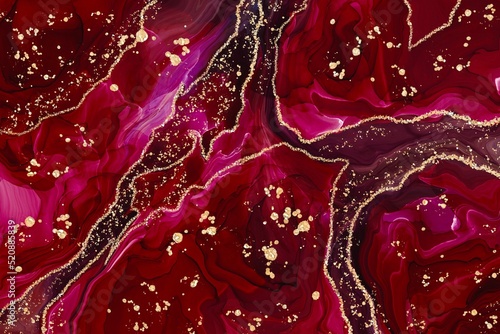Red agate marble with deep Alcohol ink fluid abstract texture fluid art with gold glitter and liquid.