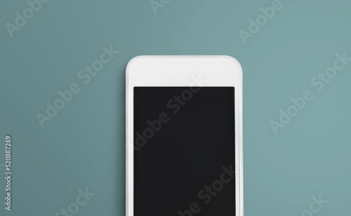 Blank screen on smartphone on color desk photo