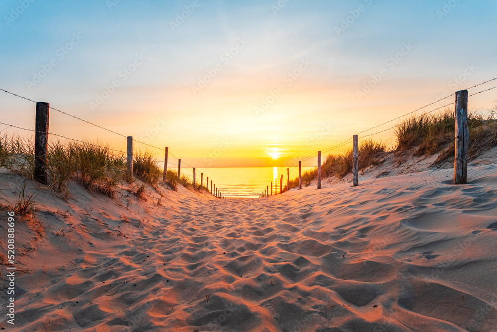 Sunset on the beach in the Netherlands over the North Sea in Zandvoort where there is a large nature park full of wildlife. Sunset on the beach in the Netherlands over the North Sea in Zandvoort where there is a large nature park full of wildlife.
