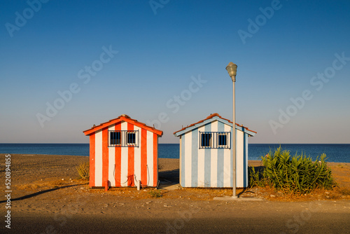 Two colorful booths at Afandou sea beach in Rhodes, Greece, Europe.