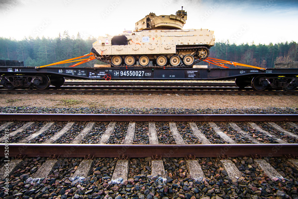 Fototapeta premium Pabrade/Lithuania October 21, 2019 US Army's 1st Armoured Battalion of the 9th Regiment, 1st Division from Fort Hood in Texas Bradley is unloaded as they arrive at the Pabrade railway station.