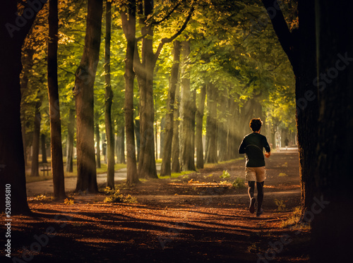 person jogging in autumn park