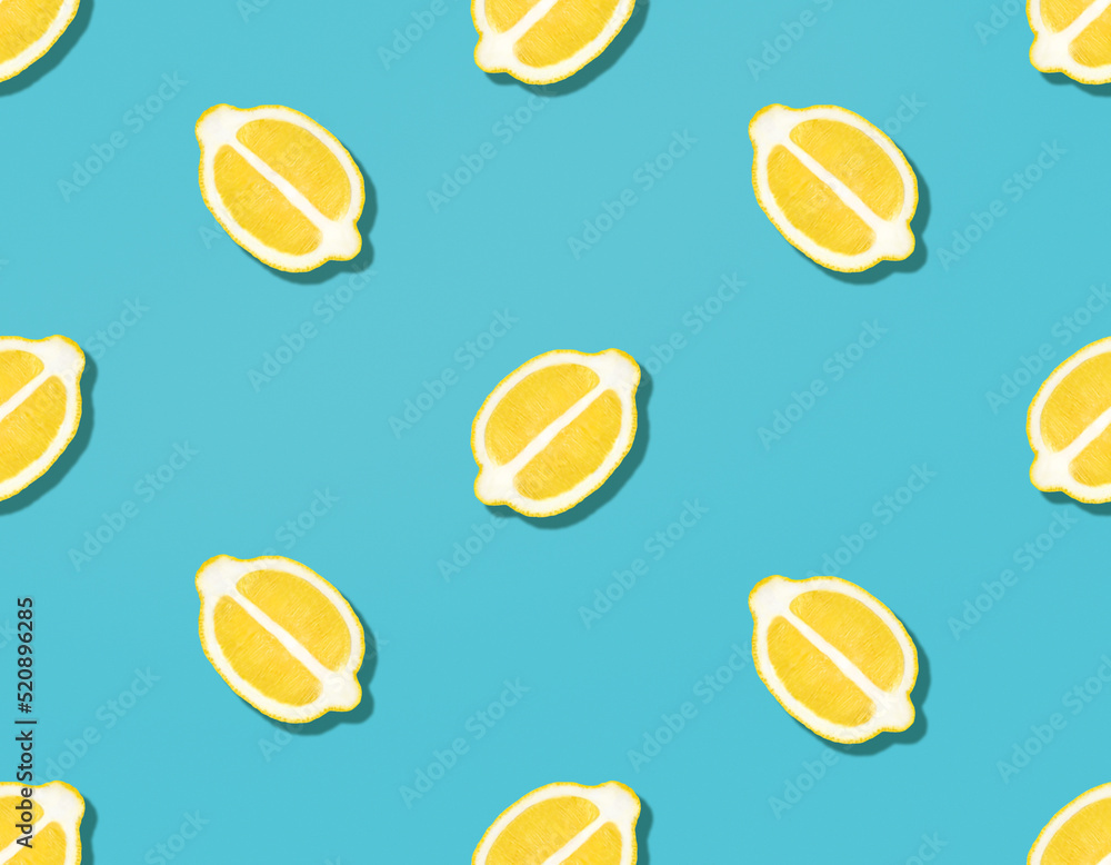 Fresh lemons. Seamless pattern. Halved ripe citrus fruits on blue backdrop