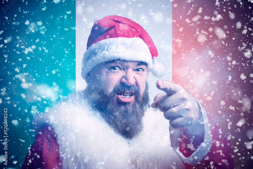 Isolate. Cold weather. Bask. A man in a fur hat and scarf warms his hands with his mouth. It's winter time Isolate. Cold weather. Bask. A man in a fur hat and scarf warms his hands with his mouth. It's winter time