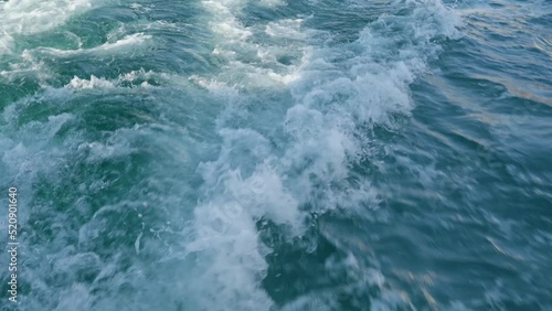 Splash water wave with foam made from the boat's motor in ocean