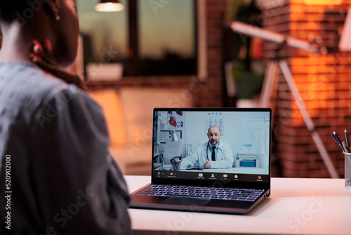 Woman having appointment with doctor on videocall using laptop, telehealth concept. Online consultation with professional medical clinic general practitioner, telemedicine service