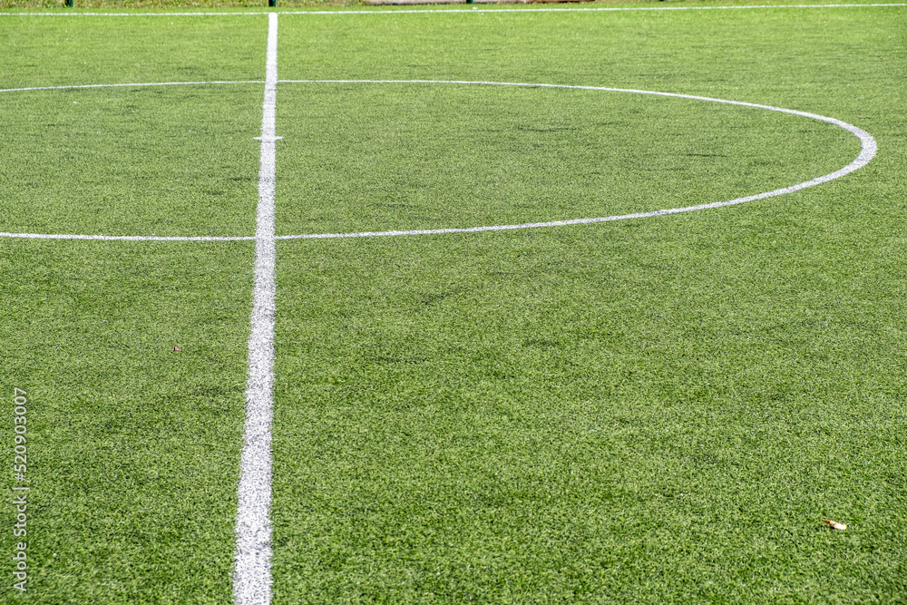 Obraz premium centre line of an artificial turf soccerll field. Sports concept