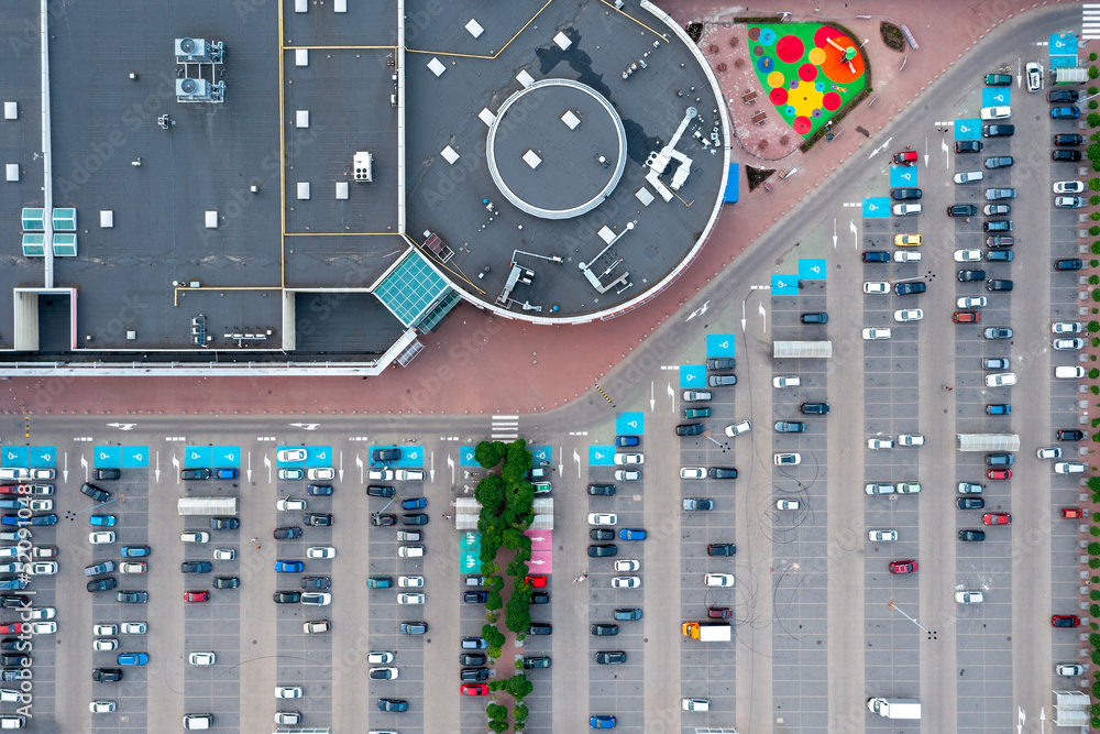 Aerial view of a parking lot near a mall Aerial view of a parking lot near a mall