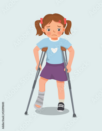 cute little girl has broken fracture leg with bandage cast on leg walking using crutches