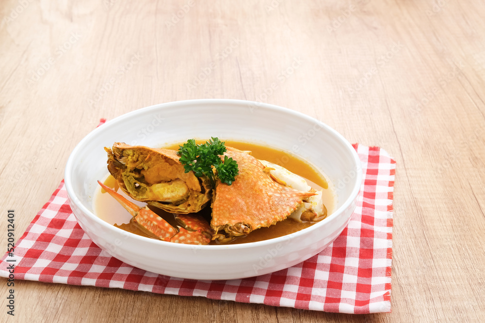 Kepiting Saus Padang (Crab with Padang Sauce), spicy and savory. Served in white bowl.
Kepiting Saus Padang (Crab with Padang Sauce), spicy and savory. Served in white bowl.