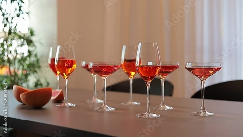 Red alcoholic drinks in glasses on the table