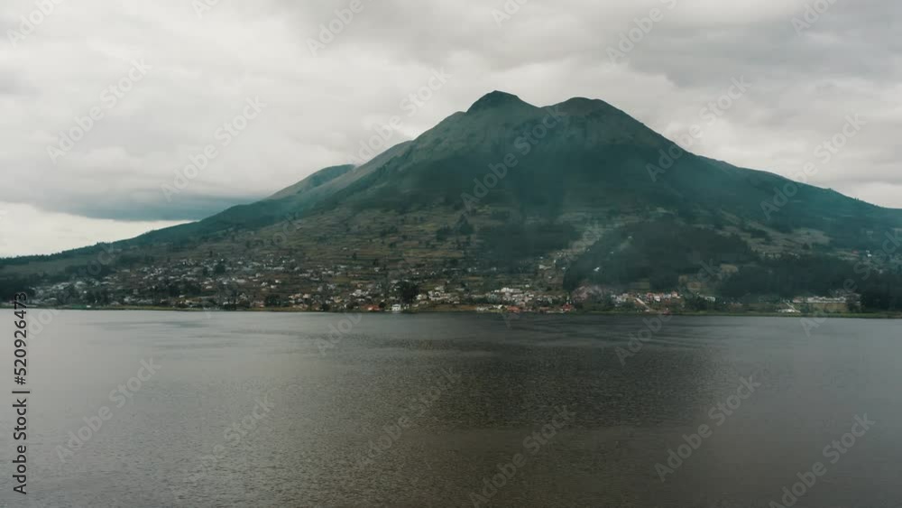 Picturesque View Of San Pablo Lake And Majestic Imbabura Volcano On A Cloudy Day In Otavalo, Ecuador. wide Picturesque View Of San Pablo Lake And Majestic Imbabura Volcano On A Cloudy Day In Otavalo, Ecuador. wide