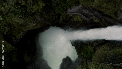 Top View Of Water Splashing Down From Pailon Del Diablo Waterfall On The Foothills Of Ecuadorian Andes Near Banos In Ecuador. aerial drone top-down