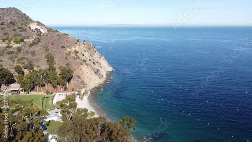 Flyby Descando Beach, Catalina Island, California.  Showing part of the beach and the rocky hillside and ocean water below. photo