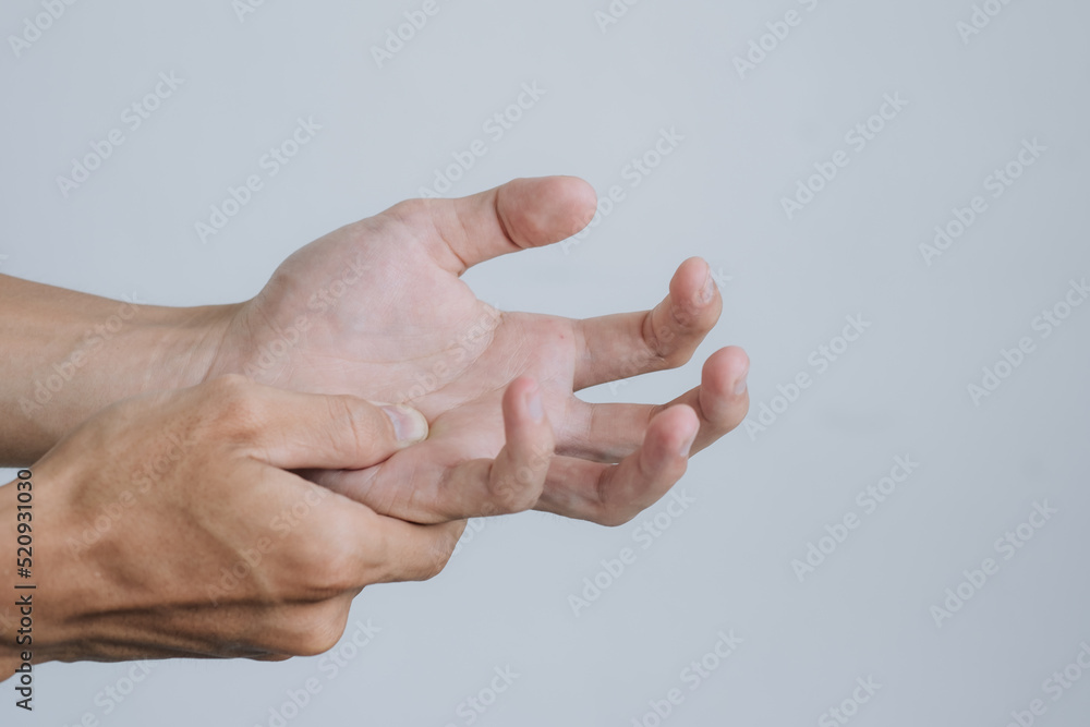 Office syndrome Concept. Young man suffering with problem trigger finger. copy space for text. Health concept.. Office syndrome Concept. Young man suffering with problem trigger finger. copy space for text. Health concept..
