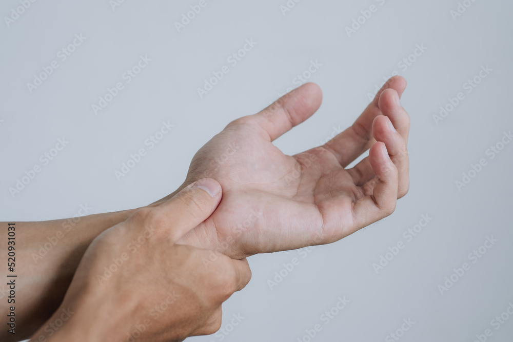 Office syndrome Concept. Young man suffering with problem trigger finger. copy space for text. Health concept.. Office syndrome Concept. Young man suffering with problem trigger finger. copy space for text. Health concept..
