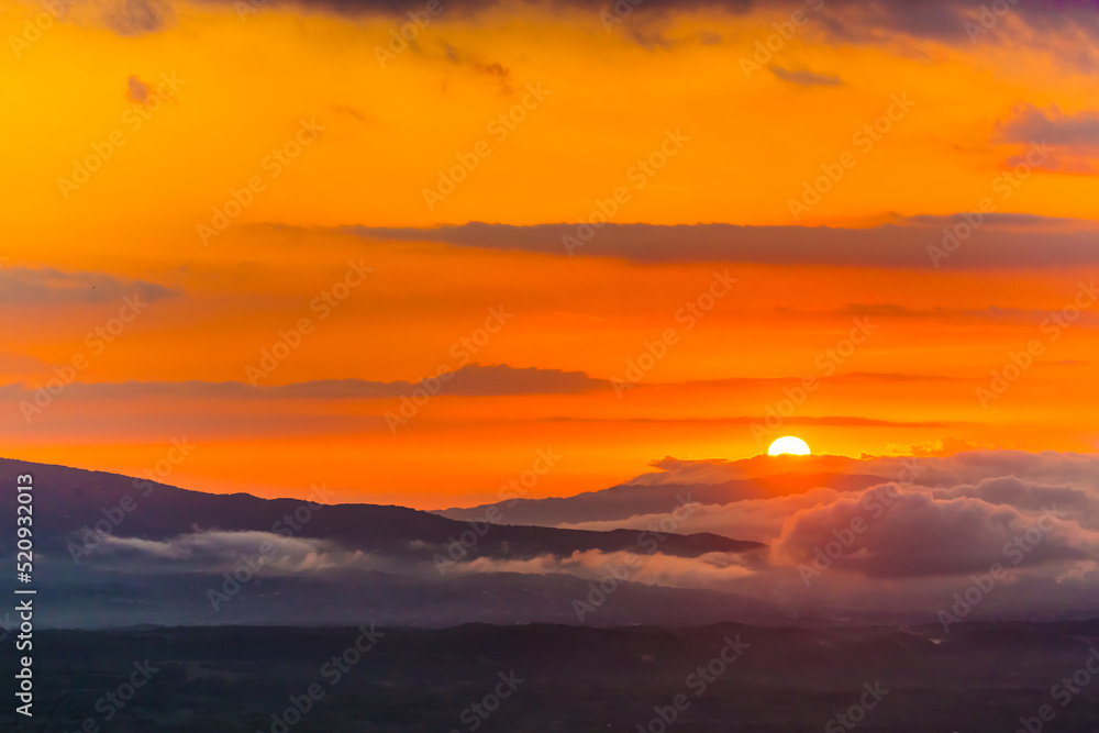 sunset in the mountains with clouds