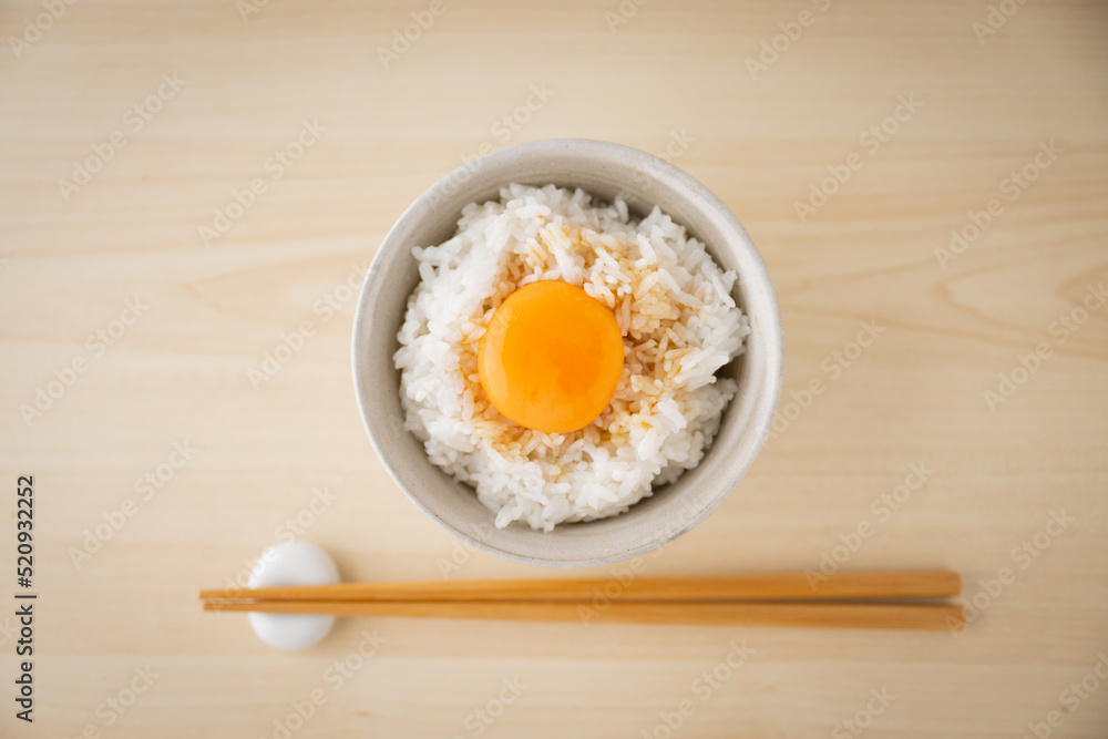 Tamagokake gohan, raw egg yolk on white rice, japanese breakfast Tamagokake gohan, raw egg yolk on white rice, japanese breakfast