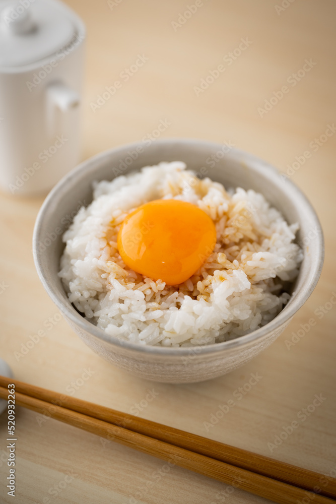 Tamagokake gohan, raw egg yolk on white rice, japanese breakfast Tamagokake gohan, raw egg yolk on white rice, japanese breakfast