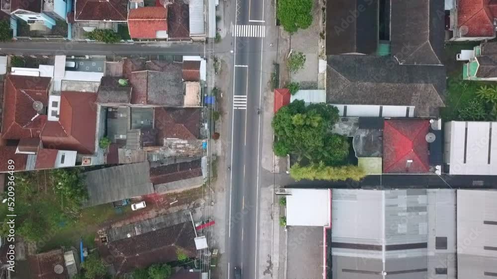Aerial overhead shot of traffic on highway in beautiful housing area in Central Java Aerial overhead shot of traffic on highway in beautiful housing area in Central Java
