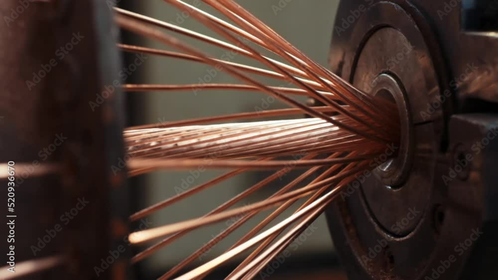 Modern cable manufacturing, cable factory. Copper cable production process in a modern factory. close-up. 4K. Cable twisting machine, industrial interior.4