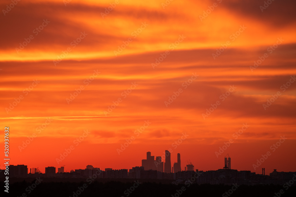 Skyline of Moscow city at sunset, Russia. Orange sky with clouds 