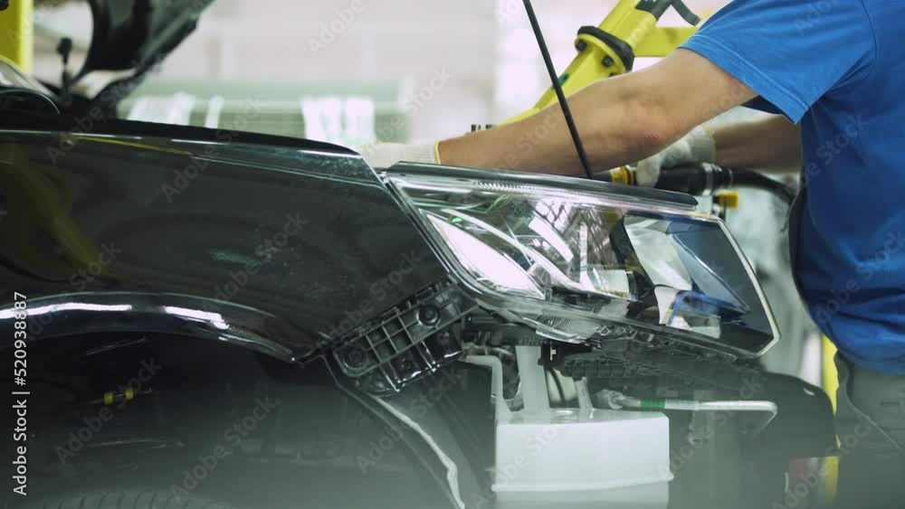 Automobile plant, modern production of cars, assembly line, workers at work, build process. Automobile plant, modern production of cars, assembly line, workers at work, build process.