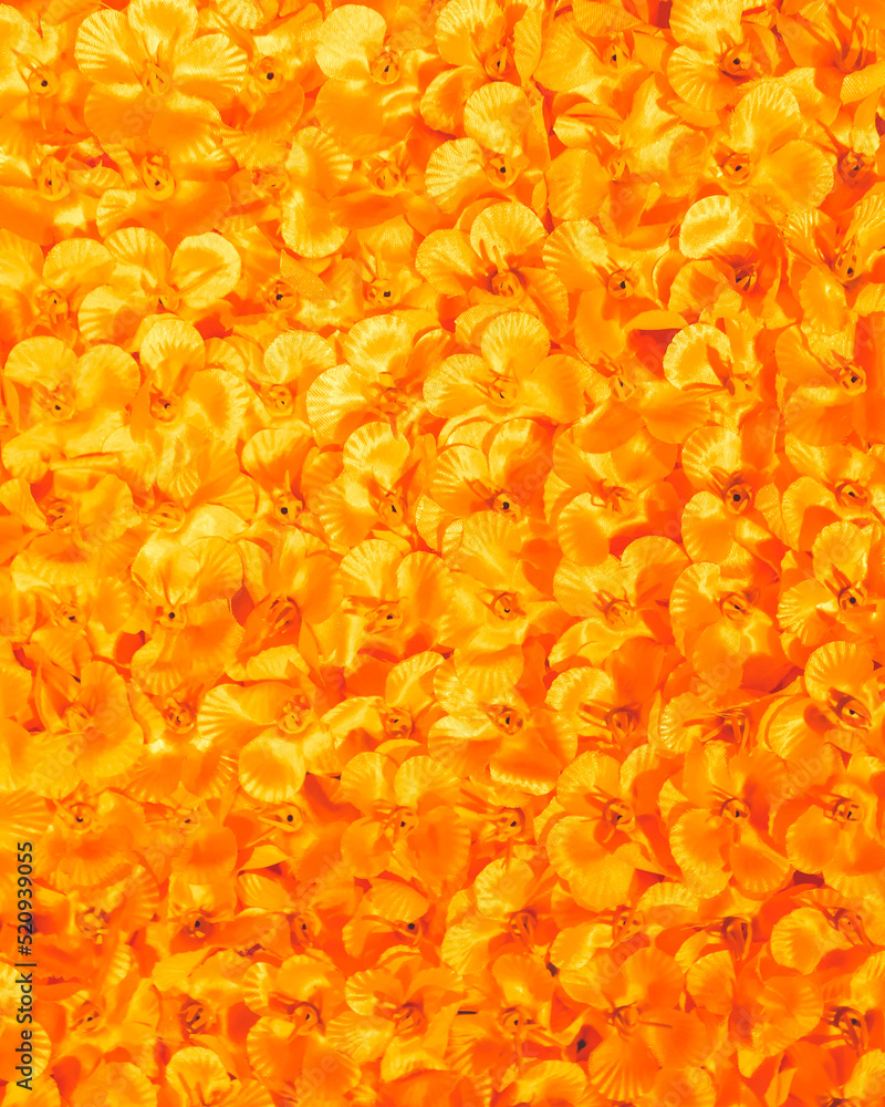 Macro shot of texture background of abstract orange artificial flowers decor at a wedding in Kolkata, West Bengal, India in March 2022.... Macro shot of texture background of abstract orange artificial flowers decor at a wedding in Kolkata, West Bengal, India in March 2022....
