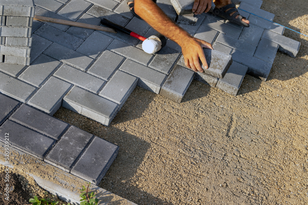 Laying paving slabs in the pedestrian zone of the city.. selective focus Laying paving slabs in the pedestrian zone of the city.. selective focus