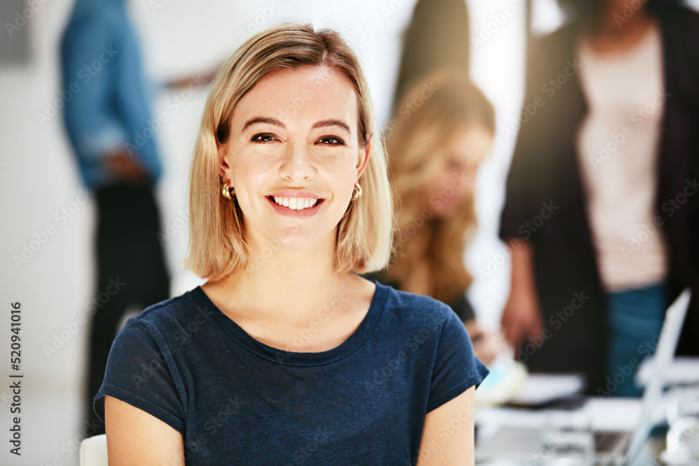 Happy, smiling and confident business woman sitting in a modern office, workspace or workplace. Portrait of a cheerful, joyful and blonde female corporate professional working at a startup company - obrazy, fototapety, plakaty 
