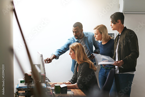 Group training, workshop and learning to brainstorm ideas and collaborate. Young diverse focused employees working as a team in the office. Coaching, mentor and feedback from staff in workplace.