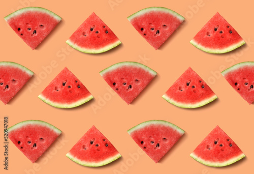 Fototapeta Naklejka Na Ścianę i Meble -  Texture of watermelon slices on an orange background
