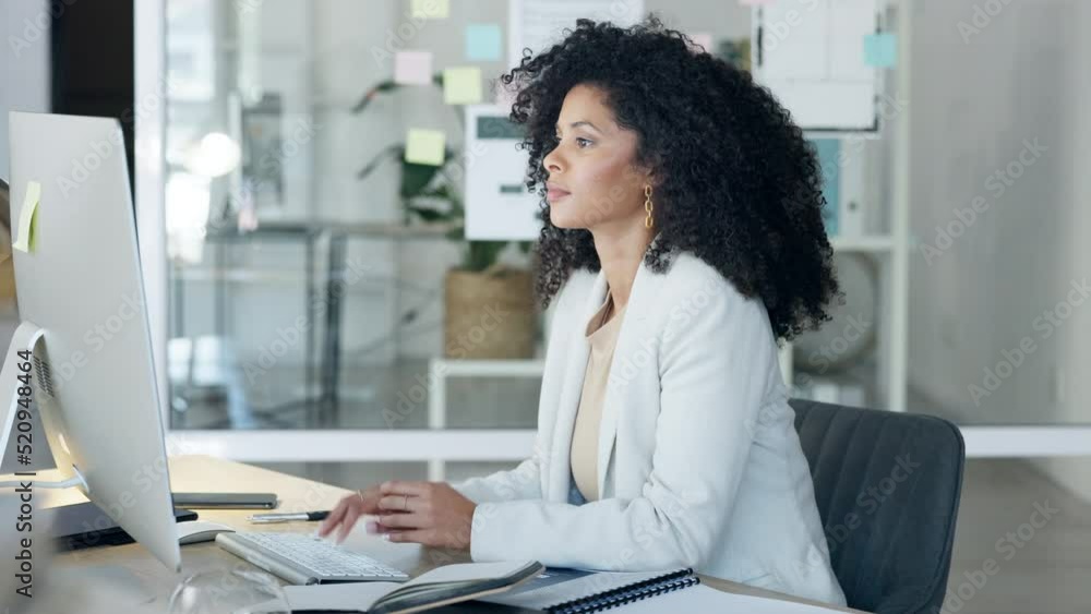Business woman typing an email, looking confused and thinking on a desktop computer while working in an office alone. Female corporate professional, assistant or secretary looking thoughtful