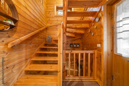 Wooden stairs in a small country house. Hallway of cozy house in a village.