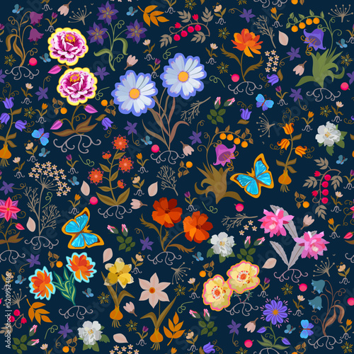 Seamless ornament with beautifully blooming flowers, fluttering butterflies, berries on a dark blue background in vector. Luxurious summer print for fabric.