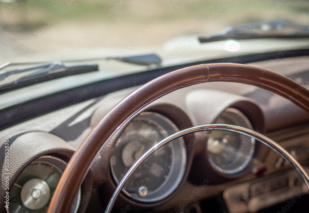 Dashboard and steering wheel of old-timer car