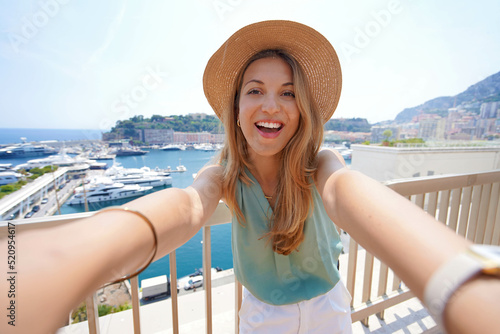 Beautiful tourist girl takes self portrait in Monte-Carlo, Monaco