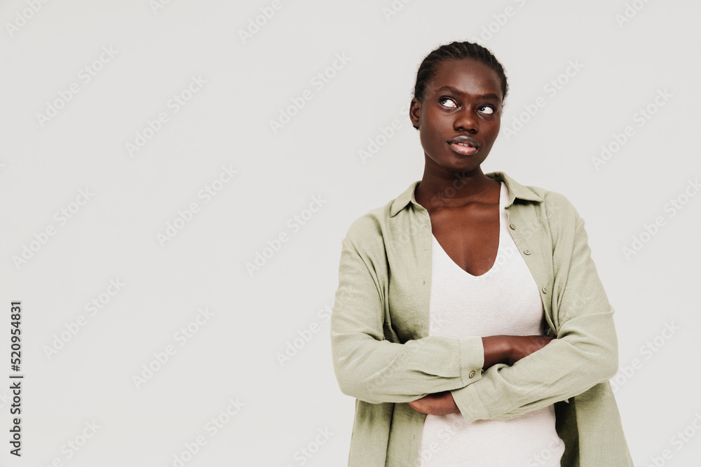 Young black woman with afro braids posing at camera Young black woman with afro braids posing at camera