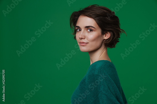 White young woman wearing sweater posing and looking at camera © Drobot Dean