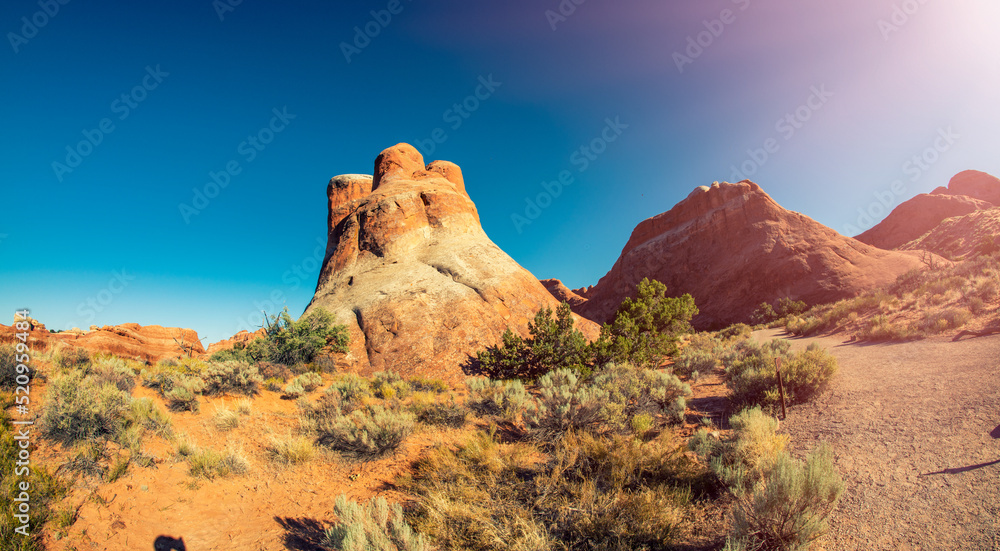 Beautiful natural rock formations in Arches National Park under a blue summer sky, Utah