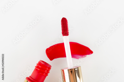 Fotografie drop of red liquid lipstick smeared on a white background