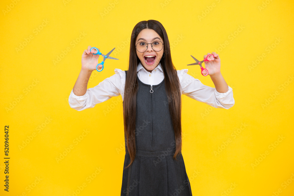 Teenage school girl with scissors, isolated on yellow background. Child creativity, arts and crafts. Teenage school girl with scissors, isolated on yellow background. Child creativity, arts and crafts.