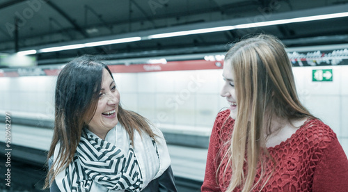 Wallpaper Mural Couple of female friends talking in the subway station Torontodigital.ca