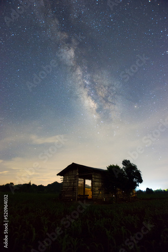 Shed under Milky Way Galaxy Lampang Thailand, Universe galaxy milky way time lapse, dark milky way, galaxy view, star lines, timelapse night sky stars on sky background.