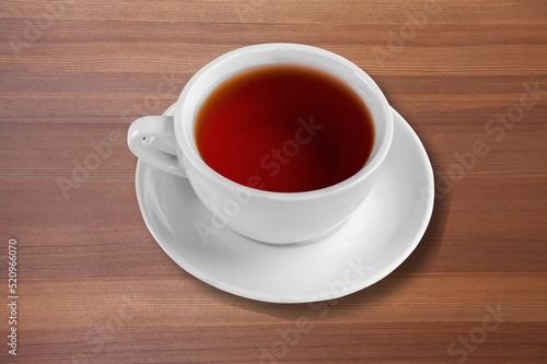 Tasty aroma tea on desk background.