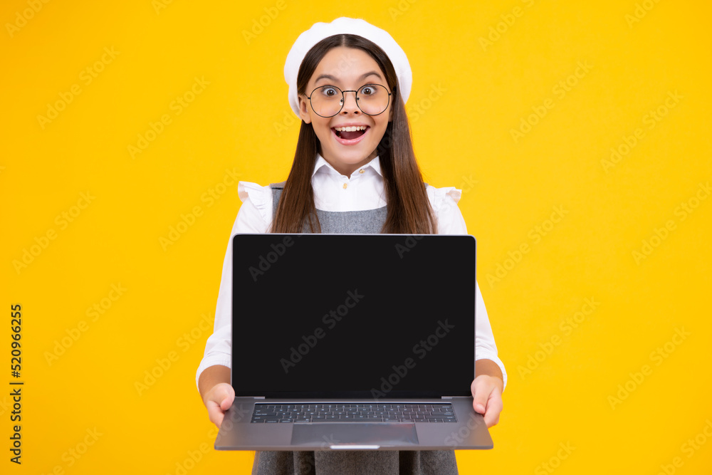 Back to school, Teenager school girl with laptop computer. Screen of laptop computer with copy space mockup. Happy face, positive and smiling emotions of teenager schoolgirl. Back to school, Teenager school girl with laptop computer. Screen of laptop computer with copy space mockup. Happy face, positive and smiling emotions of teenager schoolgirl.