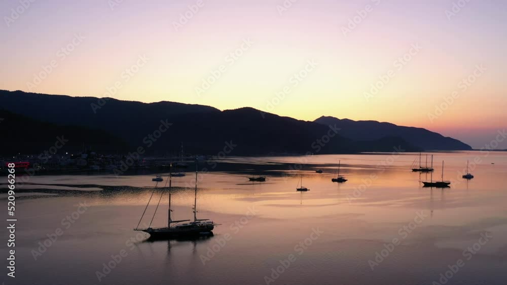 Beautiful sunset over Mediterranean sea. Sea bay with anchored boats. Vacation concept. Beautiful sunset over Mediterranean sea. Sea bay with anchored boats. Vacation concept.