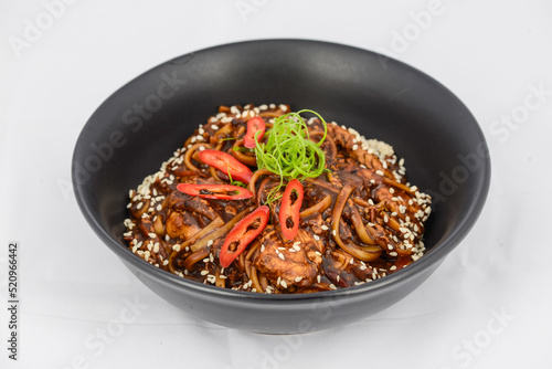 korean dish buckwheat noodles in a black plate
